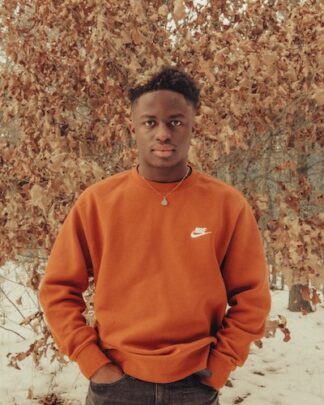 Man wearing orange Nike Sweater